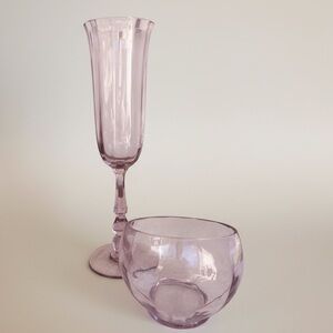 Two pieces of lavender colored glass, champagne flute and moon bowl